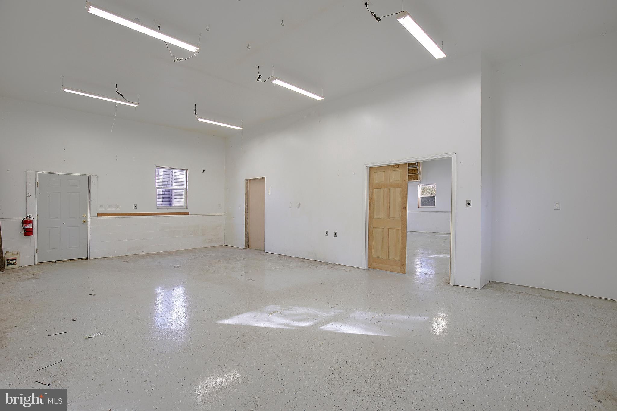 49220 Demko Road Lexington Park, MD 20653 - Photo 7 of 48 an empty room with a empty space and windows