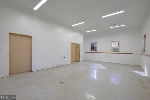 a view of a livingroom with natural light