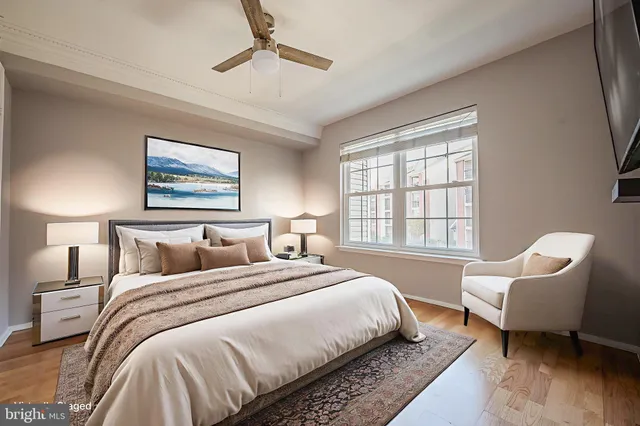 a bedroom with bed chair and window