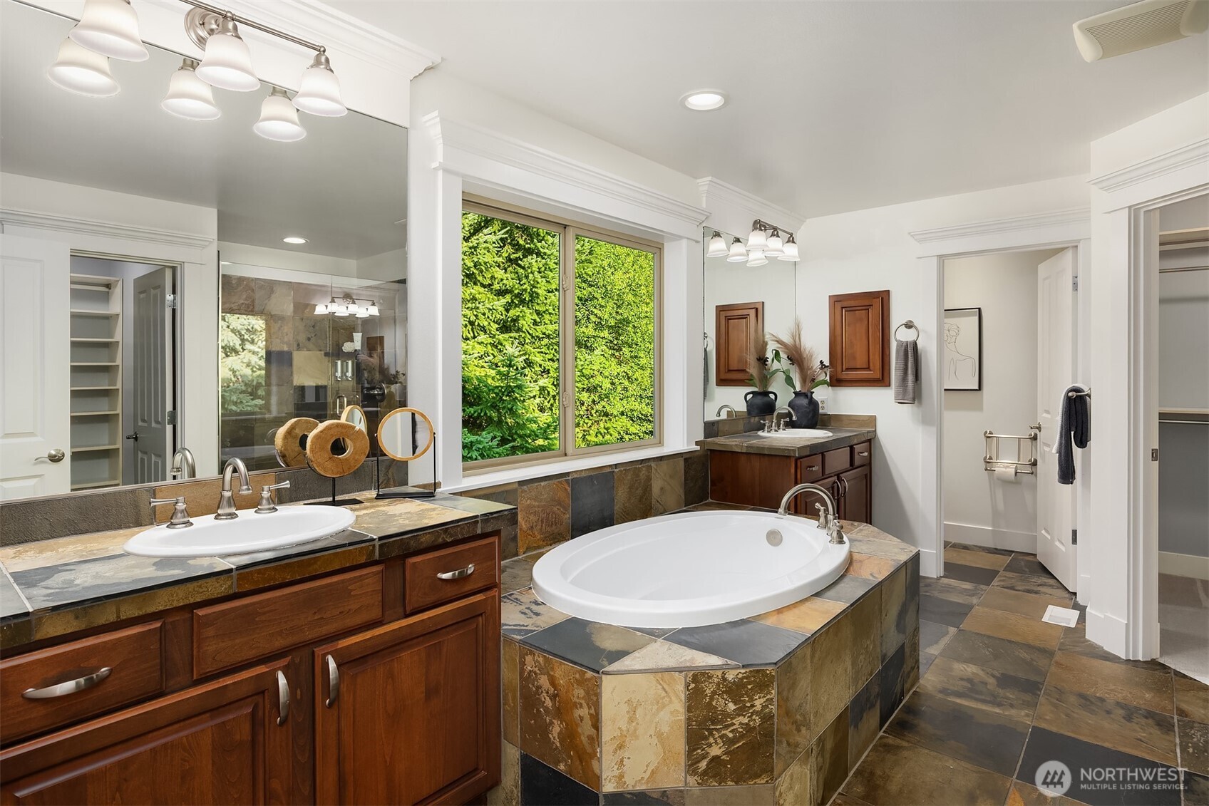 2989 Northeast Davis Loop Issaquah, WA 98029 - Photo 26 of 40 a bathroom with a sink a mirror and a bathtub