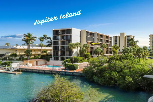 a view of swimming pool with outdoor seating and lake view