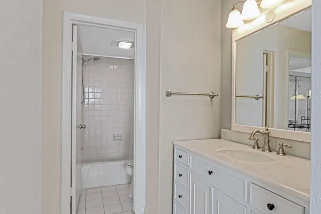 a bathroom with a shower curtain and a toilet
