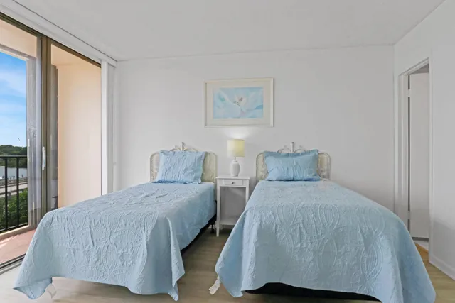 a bedroom with a large bed and a large window