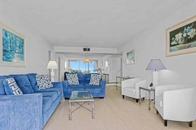 a view of a balcony with lake view and wooden floor