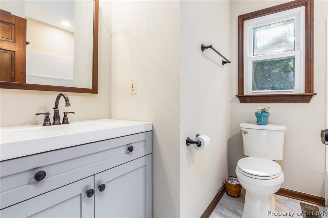 10060 Figg Shop Road Gloucester, VA 23061 - Photo 25 of 38 Newly renovated guest bath. New vanity with fixtures.