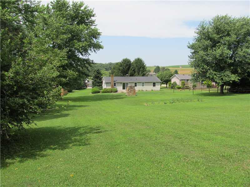 94 Lightcap Road Latrobe, PA 15650 - Photo 5 of 23 Exterior Back. An acre of ground with a gentle slope, so peaceful.