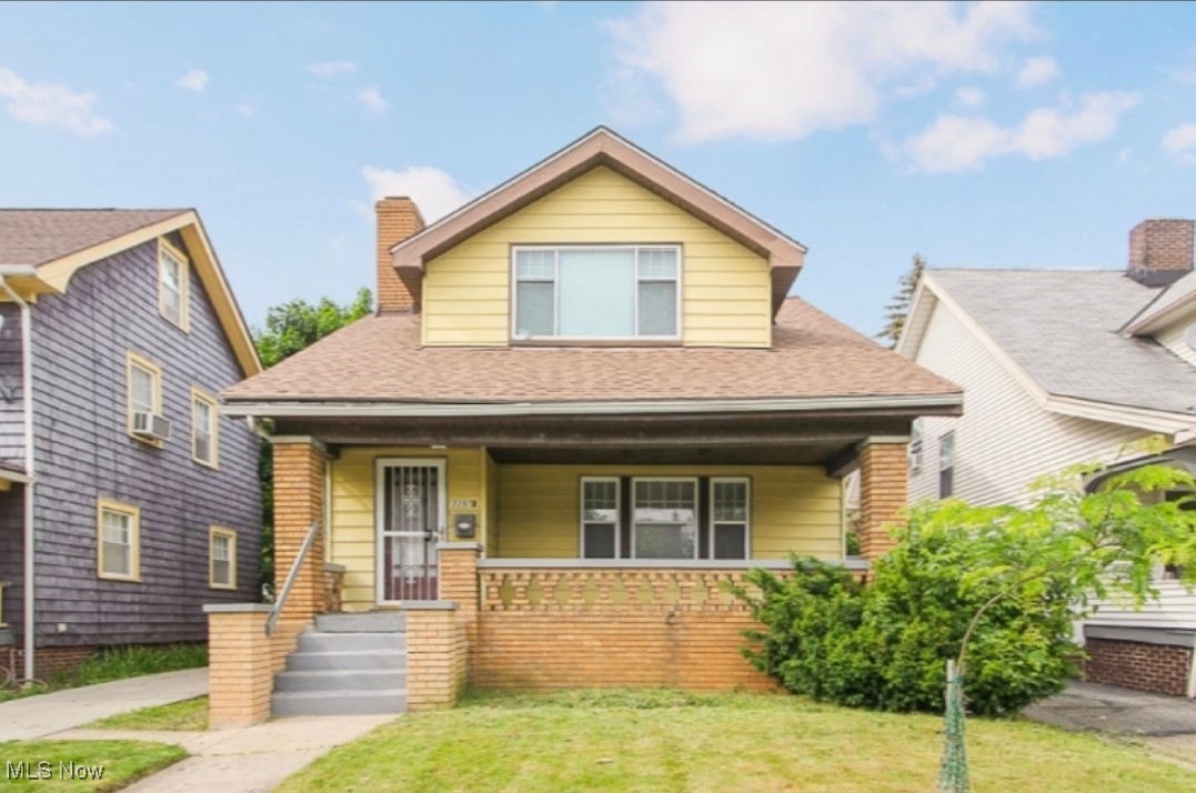 3397 Silsby Road Cleveland, OH 44118 - Photo 1 of 12 Bungalow with a chimney, roof with shingles, a porch, and a front lawn