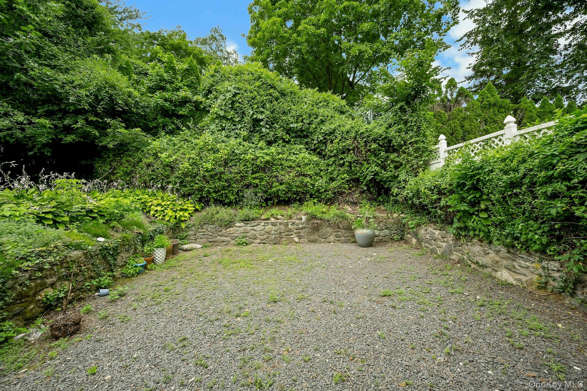 151 Clarence Road Scarsdale, NY 10583 - Photo 20 of 28 a view of a yard with a tree