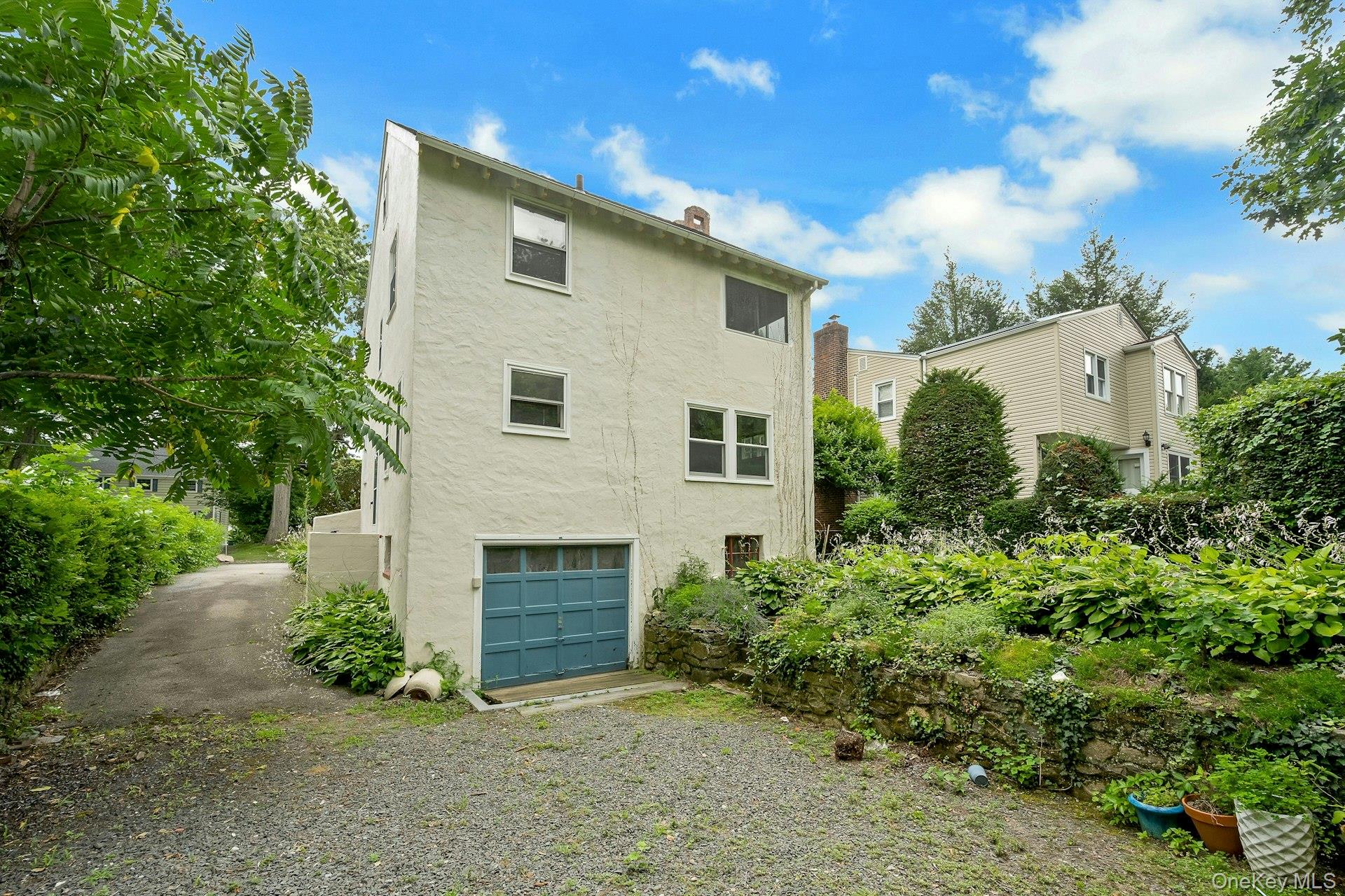 151 Clarence Road Scarsdale, NY 10583 - Photo 23 of 28 a view of a house with a yard