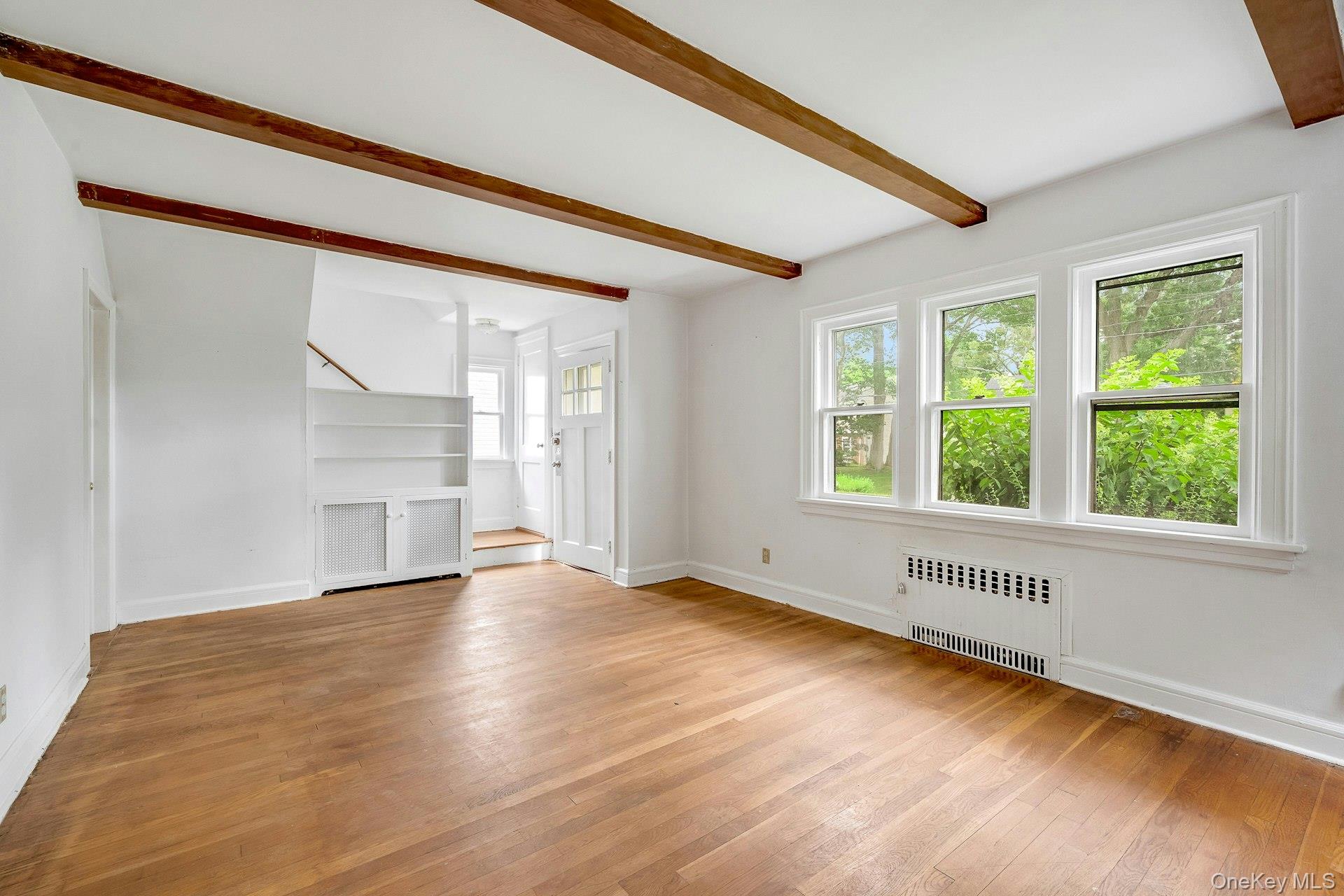 151 Clarence Road Scarsdale, NY 10583 - Photo 6 of 28 a view of an empty room with a window