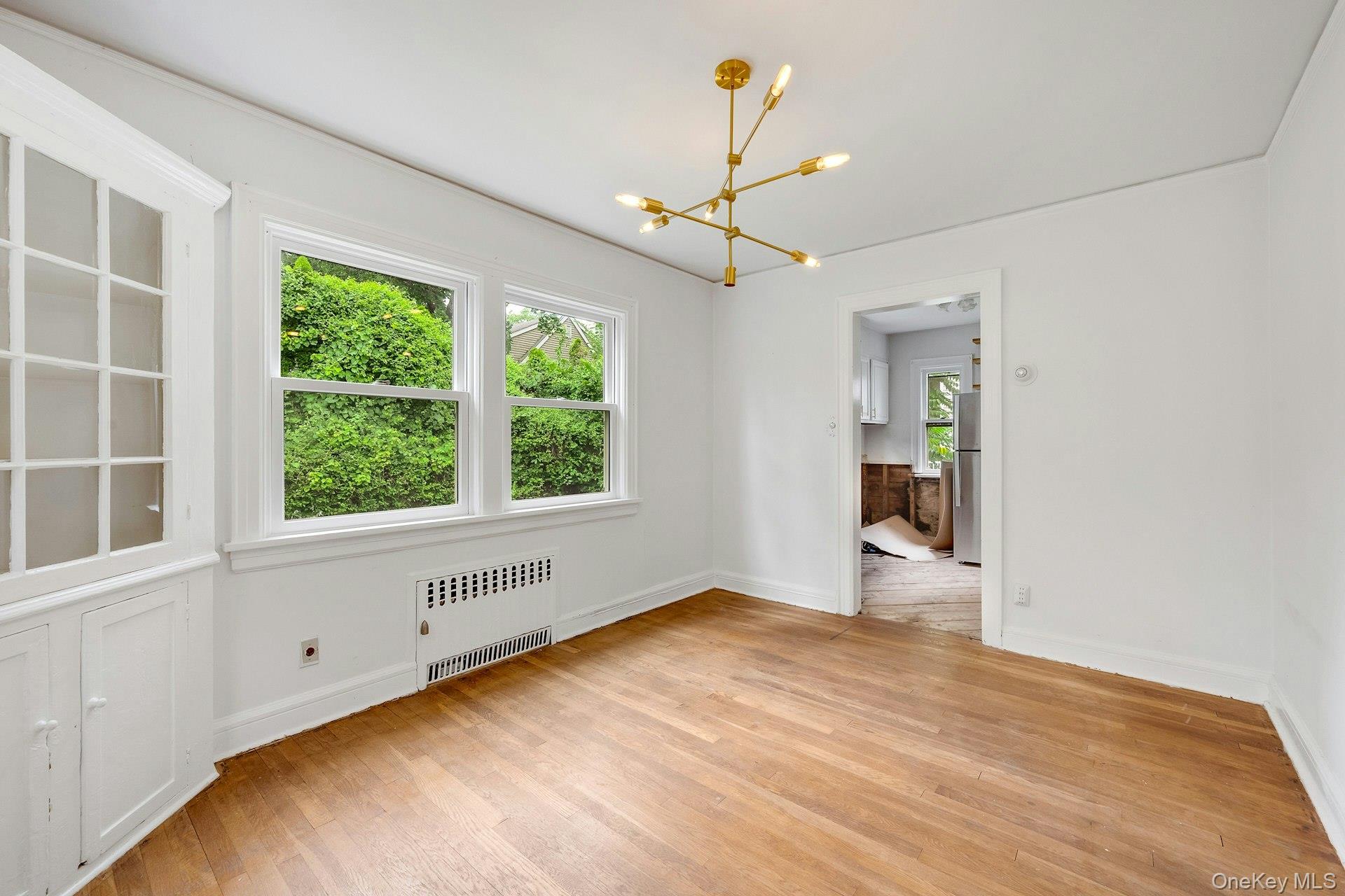 151 Clarence Road Scarsdale, NY 10583 - Photo 8 of 28 a view of an empty room with a window