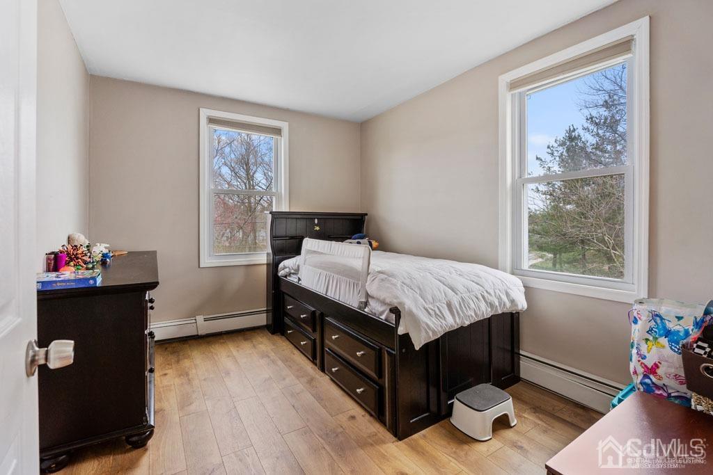 70 County Road Cliffwood, NJ 07721 - Photo 11 of 28 a bedroom with a bed and a window
