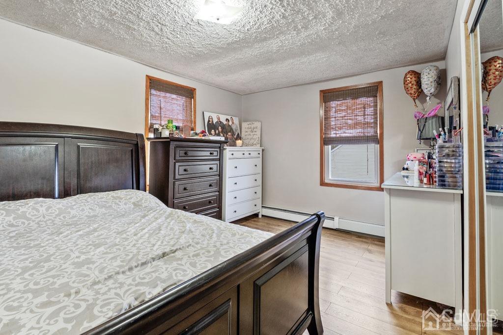 70 County Road Cliffwood, NJ 07721 - Photo 14 of 28 a bedroom with a bed and a dresser