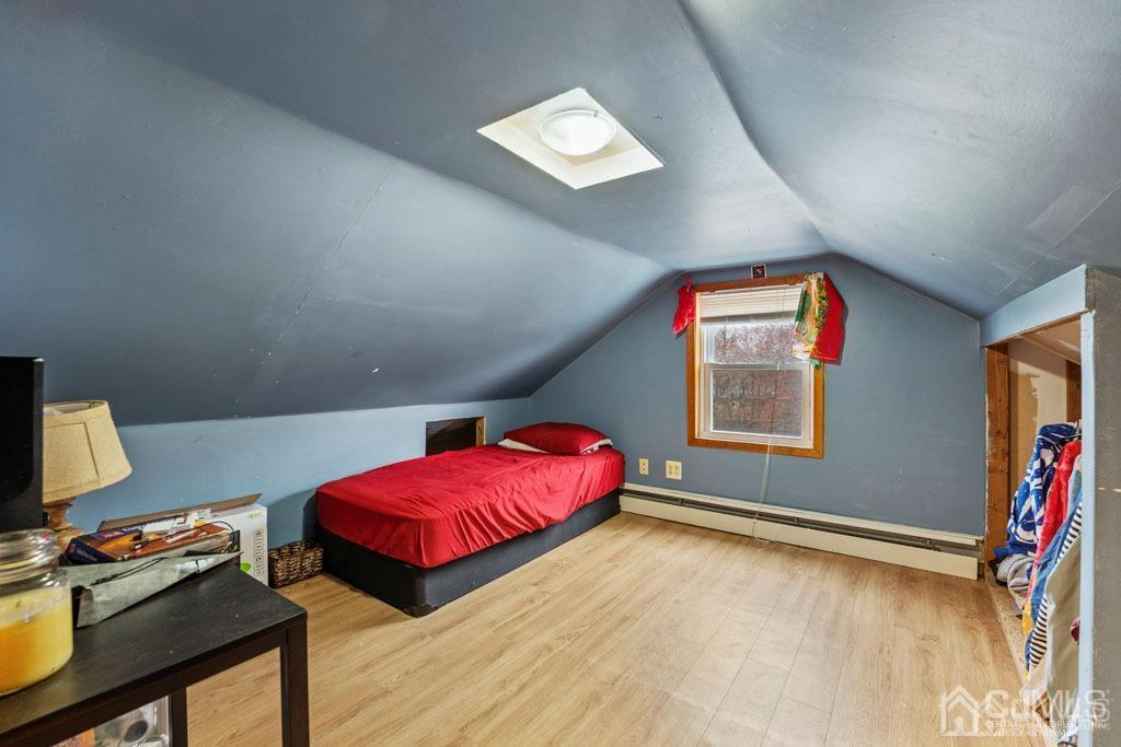 70 County Road Cliffwood, NJ 07721 - Photo 18 of 28 a living room with a bed furniture and a window