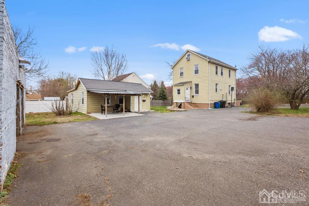 70 County Road Cliffwood, NJ 07721 - Photo 4 of 28 a front view of a house with a yard and garage