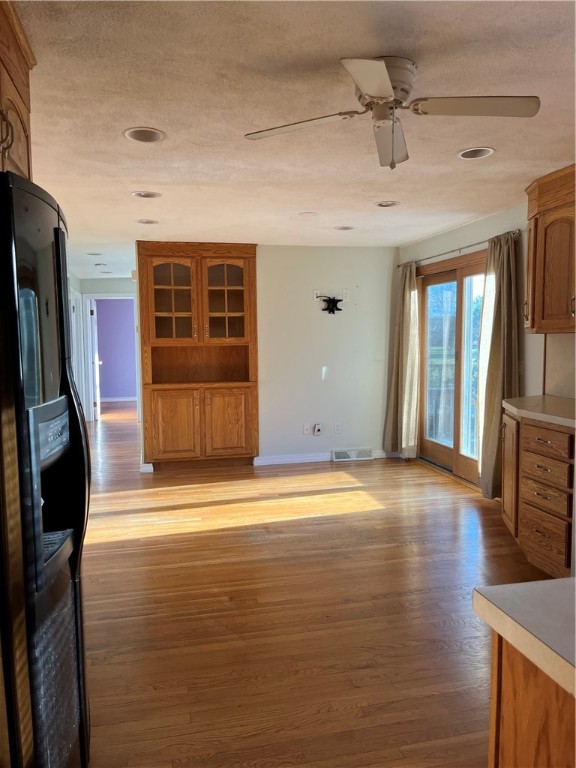 19 Del Rio Court Warwick, RI 02818 - Photo 2 of 21 Kitchen, view from garage entryway door. Rear sliding door to backyard on right.