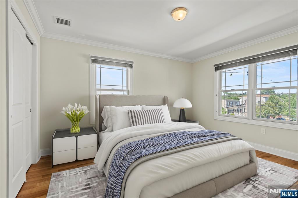 731 Stuyvesant Avenue, Unit 2 Lyndhurst, NJ 07071 - Photo 22 of 24 a bedroom with a bed table and window