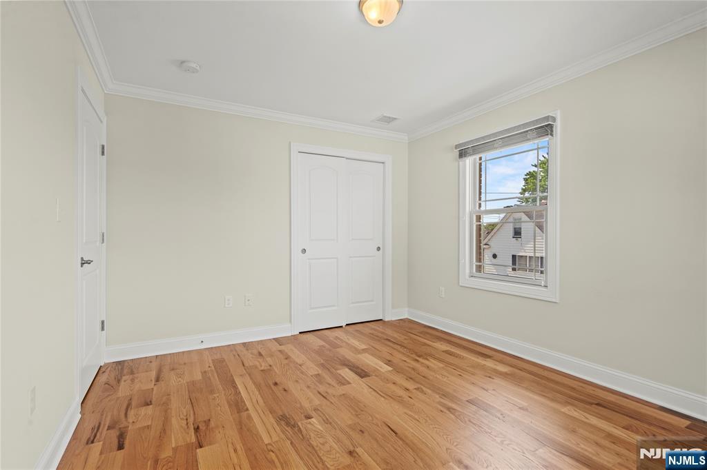 731 Stuyvesant Avenue, Unit 2 Lyndhurst, NJ 07071 - Photo 23 of 24 a view of empty room with wooden floor