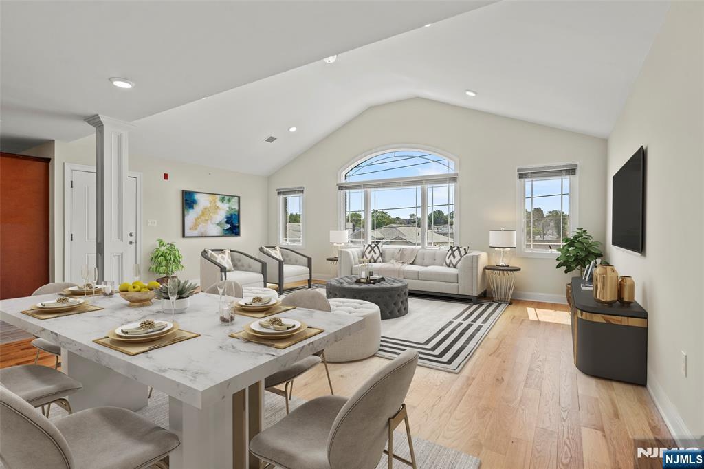 731 Stuyvesant Avenue, Unit 2 Lyndhurst, NJ 07071 - Photo 5 of 24 a living room with furniture a large window and a chandelier