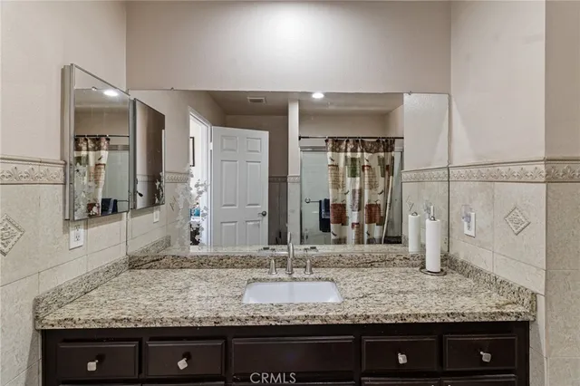 a bathroom with sink and mirror
