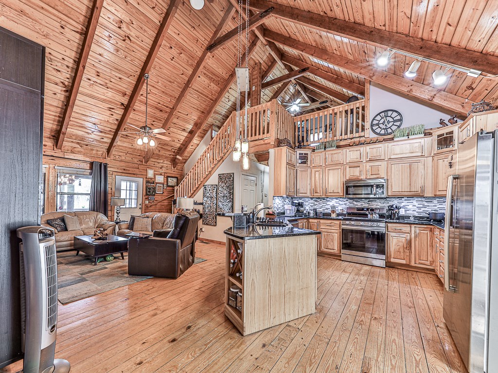 290 Ruby Lane Ellijay, GA 30540 - Photo 11 of 34 a kitchen with lots of counter top space and wooden floor