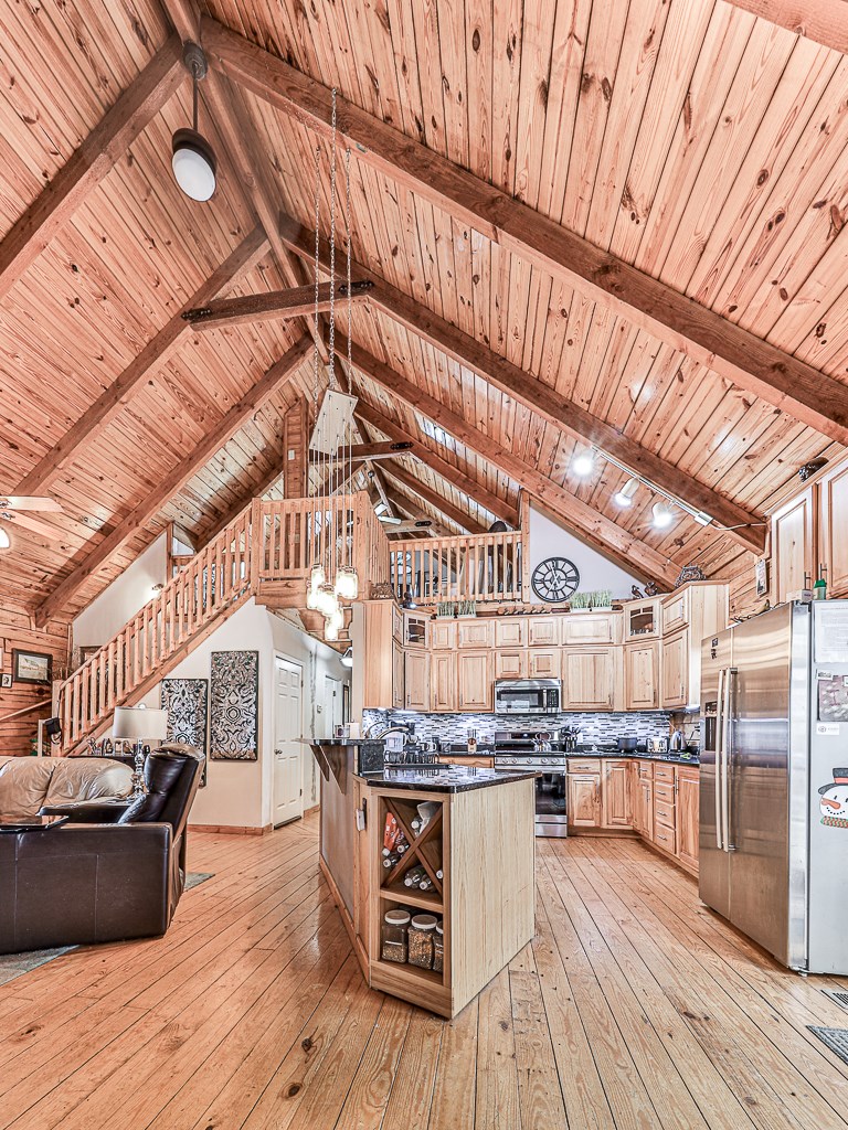 290 Ruby Lane Ellijay, GA 30540 - Photo 13 of 34 a kitchen with lots of counter top space and wooden floor