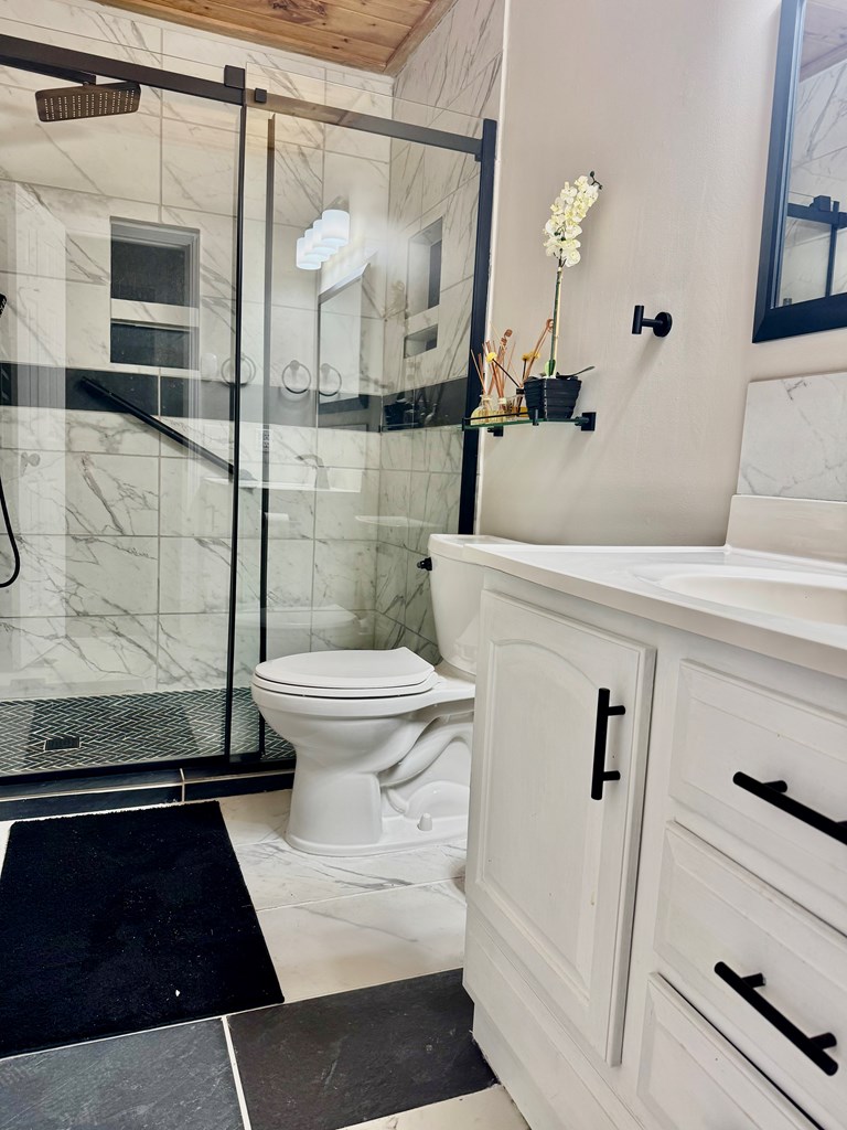 290 Ruby Lane Ellijay, GA 30540 - Photo 18 of 34 a bathroom with a sink and a mirror