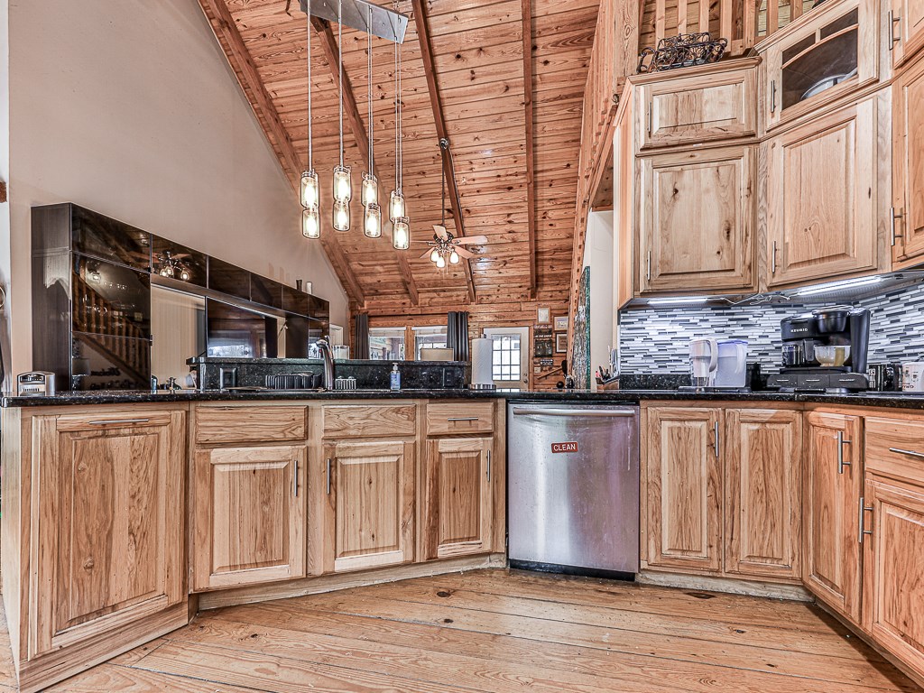290 Ruby Lane Ellijay, GA 30540 - Photo 6 of 34 a kitchen with stainless steel appliances granite countertop a sink and cabinets