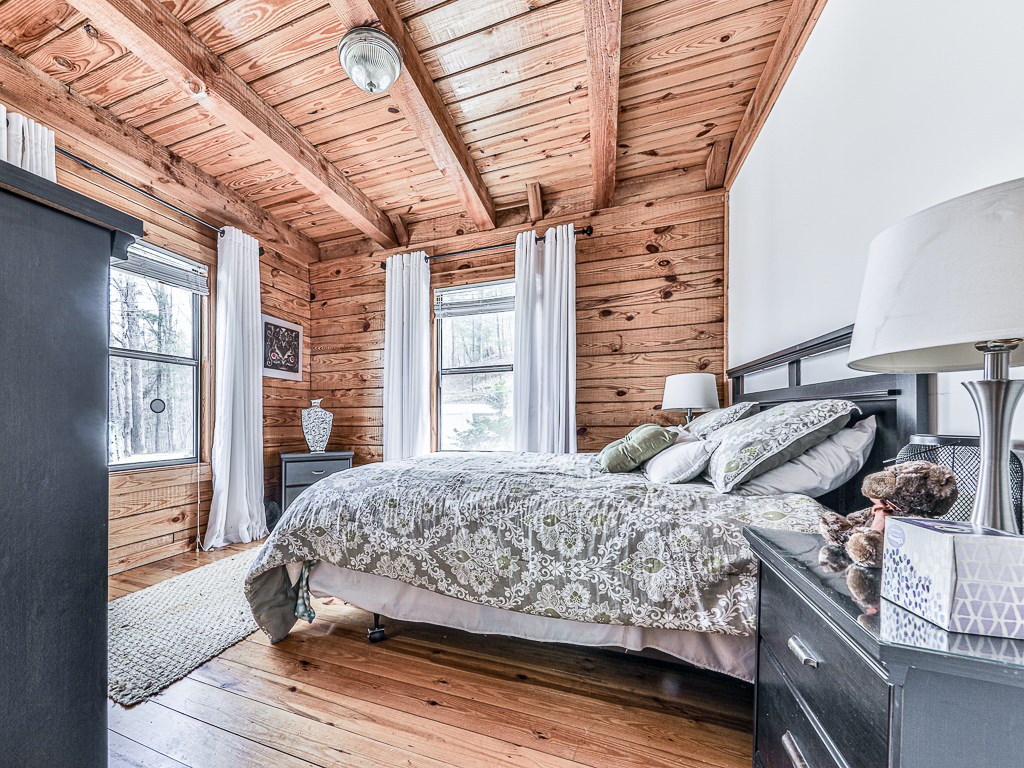 290 Ruby Lane Ellijay, GA 30540 - Photo 7 of 34 a bedroom with a bed and a large window