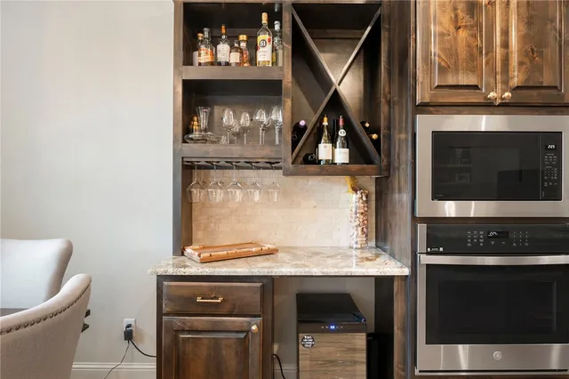 a stove top oven sitting inside of a kitchen