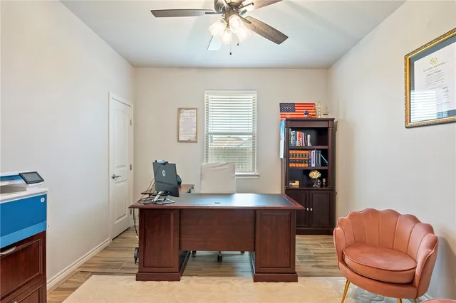 a work room with furniture and a window