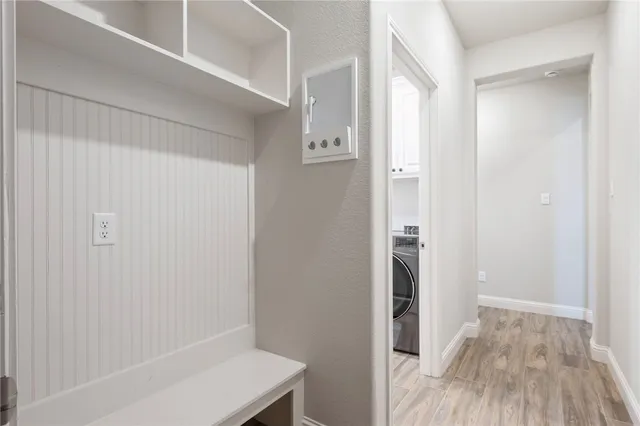 a view of bathroom with a sink mirror and shower