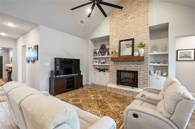 a living room with furniture and a fireplace