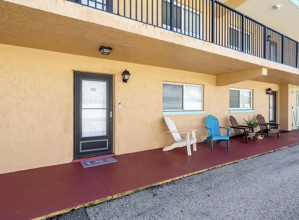 a living room with furniture and windows