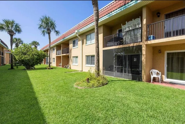 a front view of a house with outdoor space