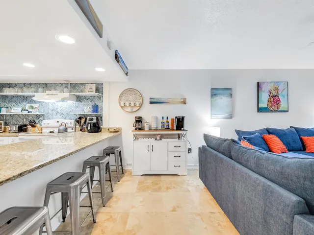 a living room with furniture and a rug