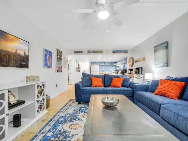 a living room with furniture and a rug