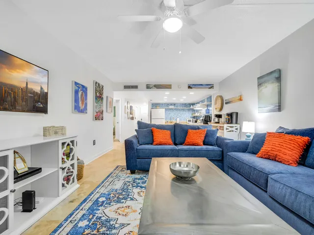a living room with furniture and a rug