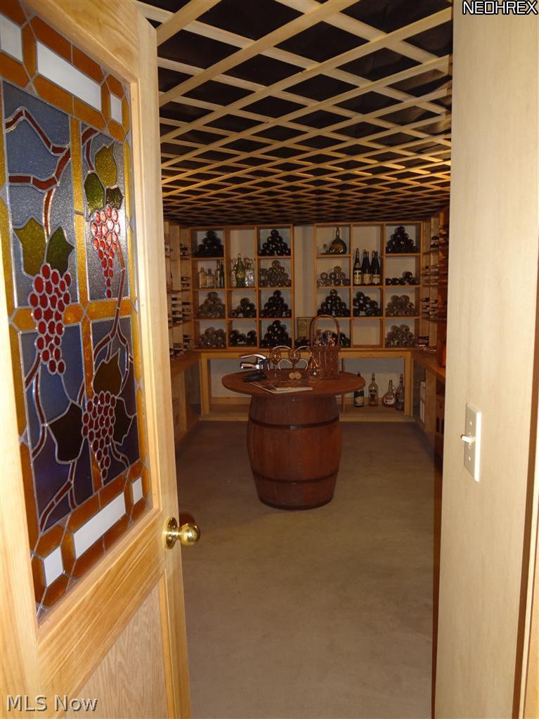 7680 Valley View Road Hudson, OH 44236 - Photo 23 of 25 This is a custom built wine cellar, complete with stained glass window and bottle storage and decorations to give it lots of character.