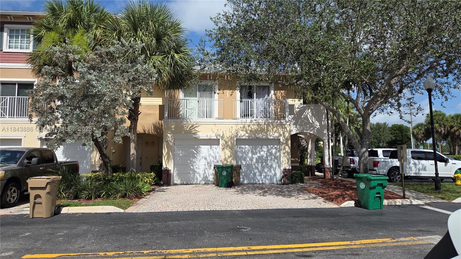4605 Southwest 75th Way, Unit 4605 Davie, FL 33314 - Photo 2 of 42 a front view of a house with a garden