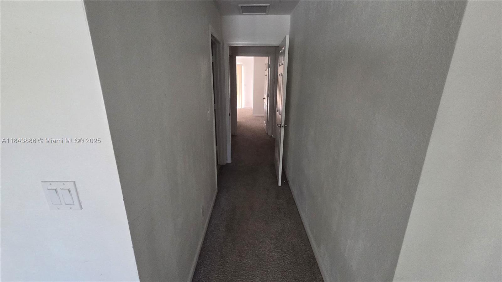 4605 Southwest 75th Way, Unit 4605 Davie, FL 33314 - Photo 23 of 42 a view of a hallway