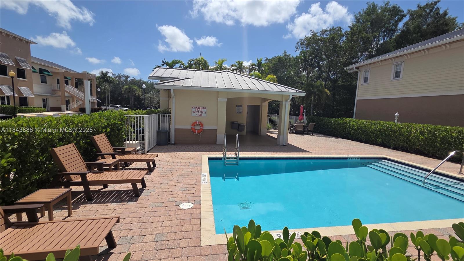 4605 Southwest 75th Way, Unit 4605 Davie, FL 33314 - Photo 36 of 42 a view of a patio with table and chairs with wooden floor and fence