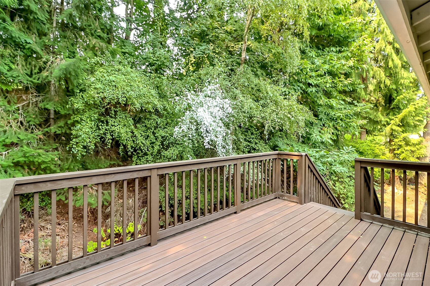 20015 108th Avenue Northeast Bothell, WA 98011 - Photo 15 of 28 a balcony with wooden floor and fence