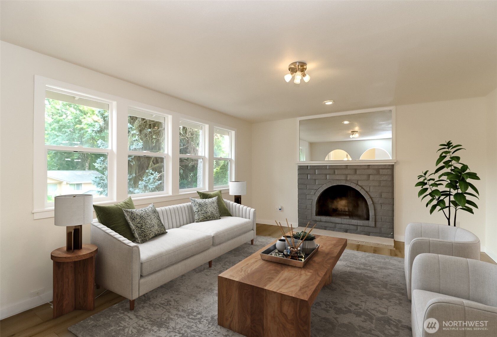 20015 108th Avenue Northeast Bothell, WA 98011 - Photo 3 of 28 a living room with furniture and a fireplace