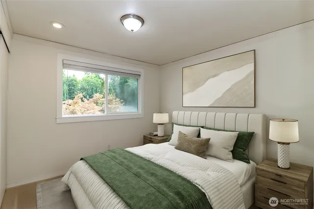 a bedroom with a bed and a window