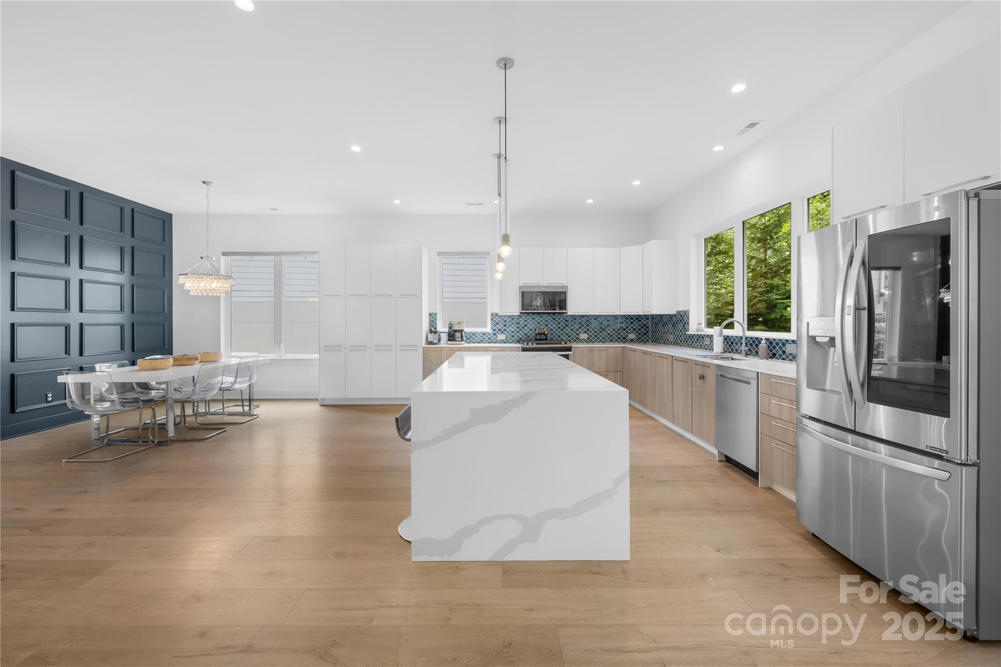 1627 Rama Road Charlotte, NC 28211 - Photo 14 of 43 a large kitchen with kitchen island a large counter top stainless steel appliances and cabinets