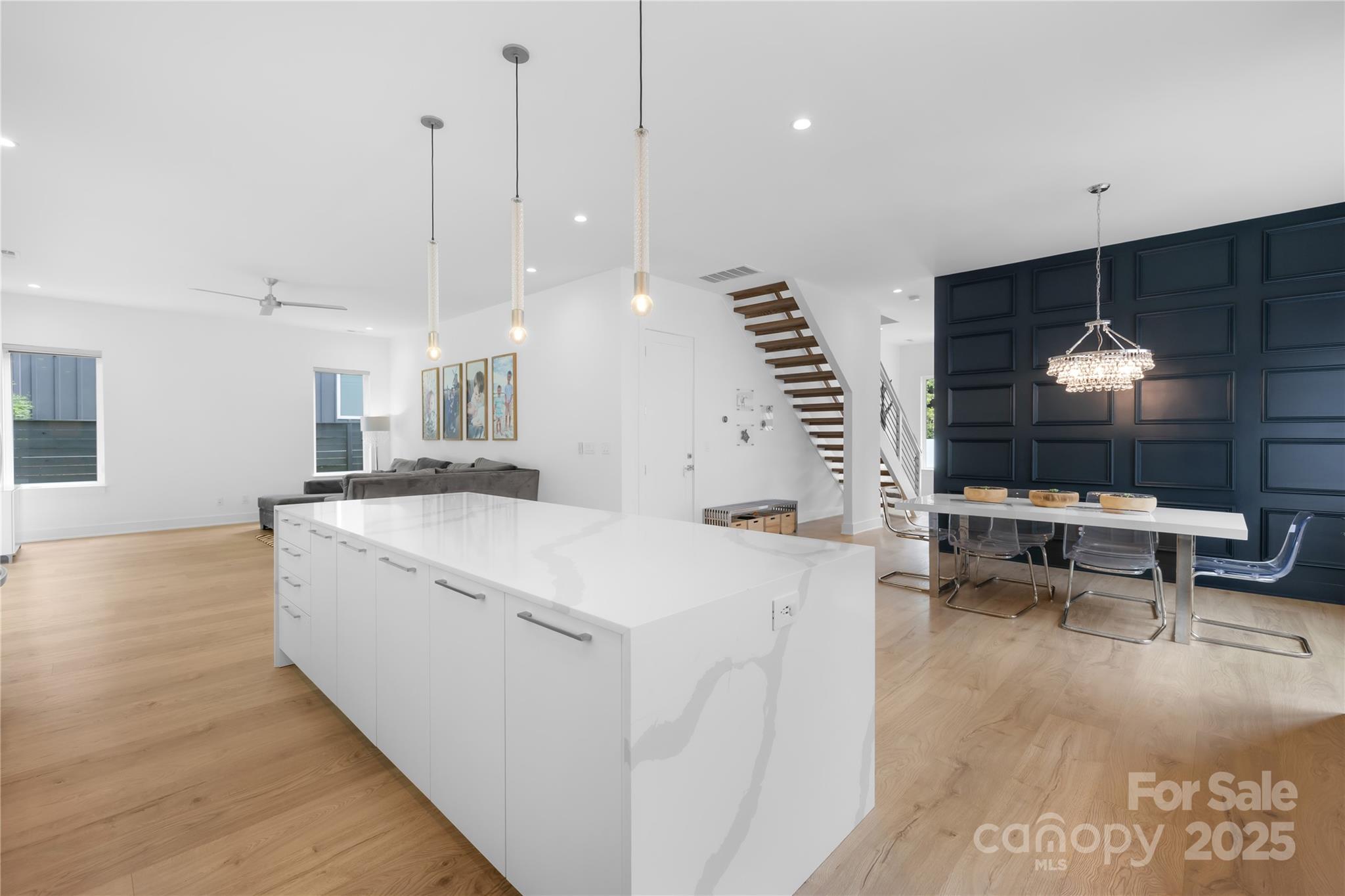 1627 Rama Road Charlotte, NC 28211 - Photo 16 of 43 a large white kitchen with a large island oven a sink and a counter space