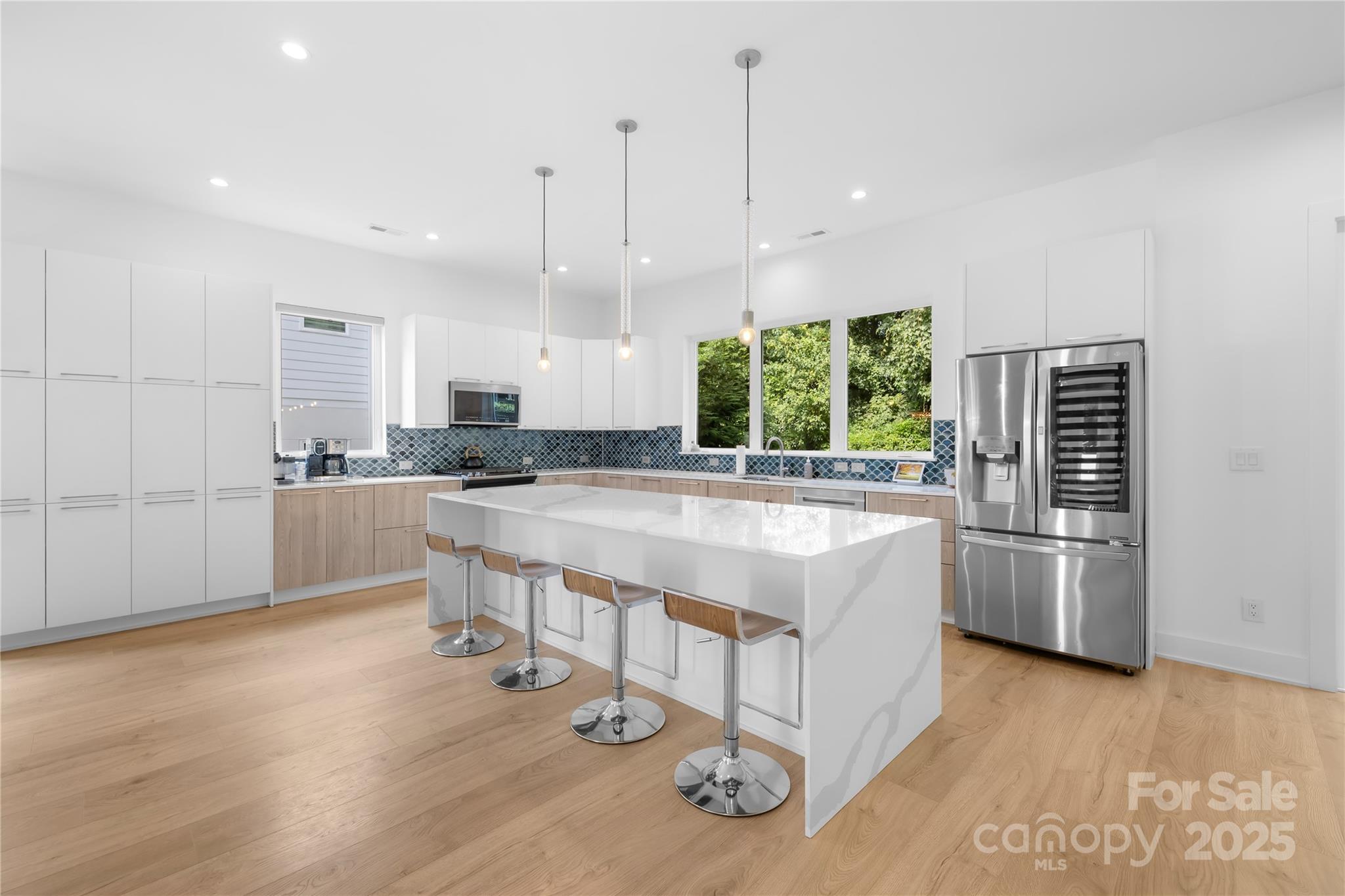 1627 Rama Road Charlotte, NC 28211 - Photo 18 of 43 a large white kitchen with a large window