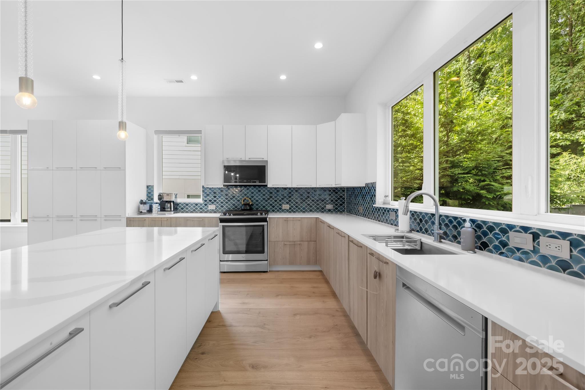1627 Rama Road Charlotte, NC 28211 - Photo 20 of 43 a large white kitchen with a large window