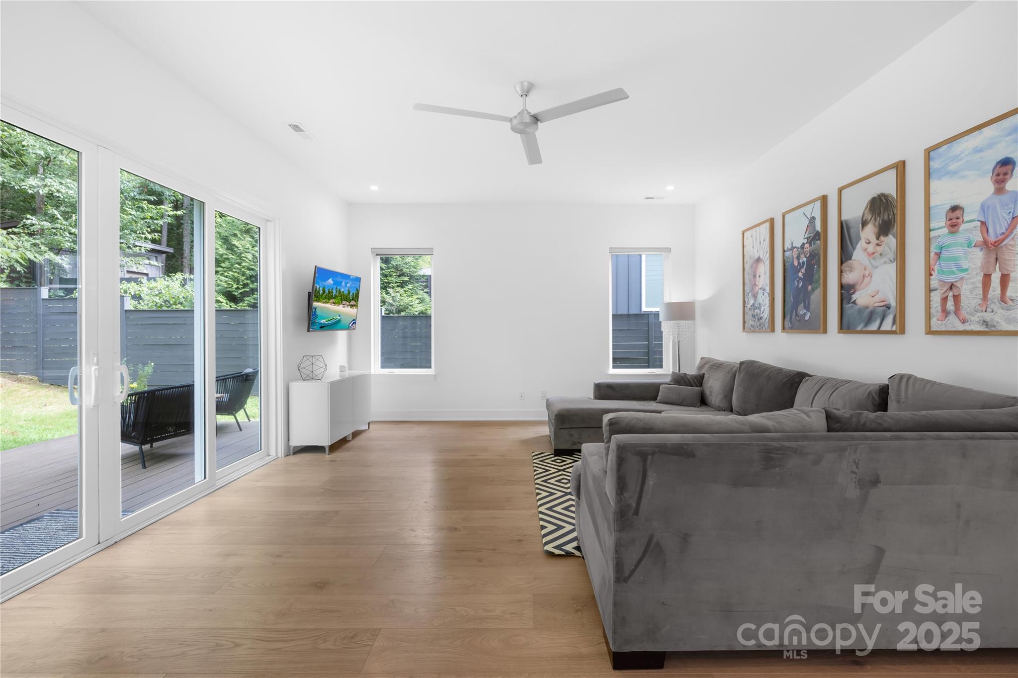 1627 Rama Road Charlotte, NC 28211 - Photo 22 of 43 a living room with furniture a flat screen tv and a large window